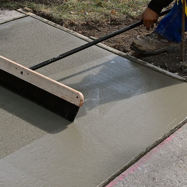newly poured cement in the ground