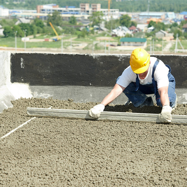 worker flattening the cement